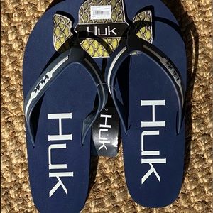 Navy and white HUK flip flops.. brand new